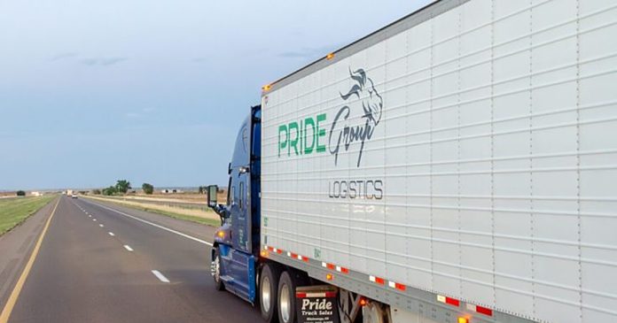 Pride Group Logistics truck on the highway, representing the company's sale back to the founding Johal family after creditor protection under CCAA.