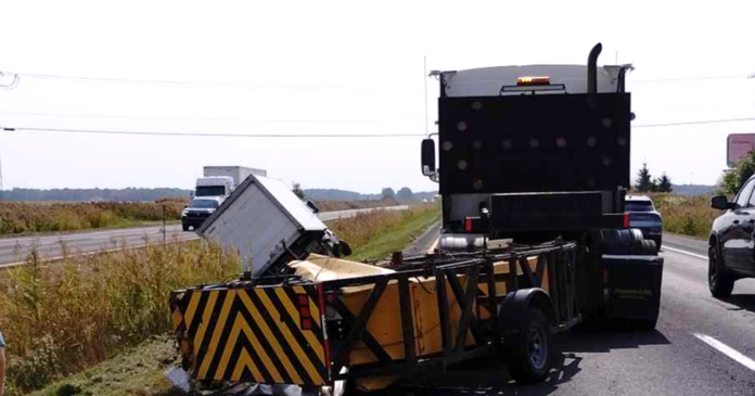 Jacques Dubé and his vehicle after a box truck collision on Highway 35, showcasing the importance of impact attenuators in preventing roadwork tragedies.