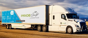 Pride Group Logistics truck on the highway, representing the company's sale back to the founding Johal family after creditor protection under CCAA.