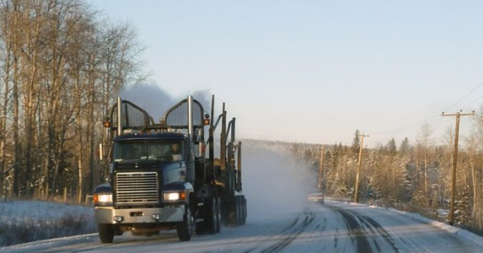 A heavy truck on Highway 11/17 in Northern Ontario, illustrating the safety challenges faced by truckers and road users.