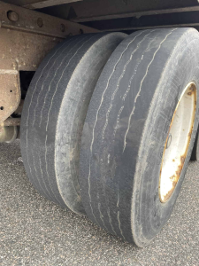 Truck driving school vehicle stopped by the Ontario Provincial Police (OPP) for significant safety violations, highlighting ongoing issues in driver training standards.

