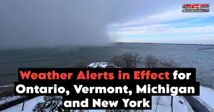 A lake effect snowstorm with challenging conditions, including heavy snowfall, reduced visibility, and snow-covered roads affecting multiple regions, to represent the weather alerts in effect in multiple province and states.